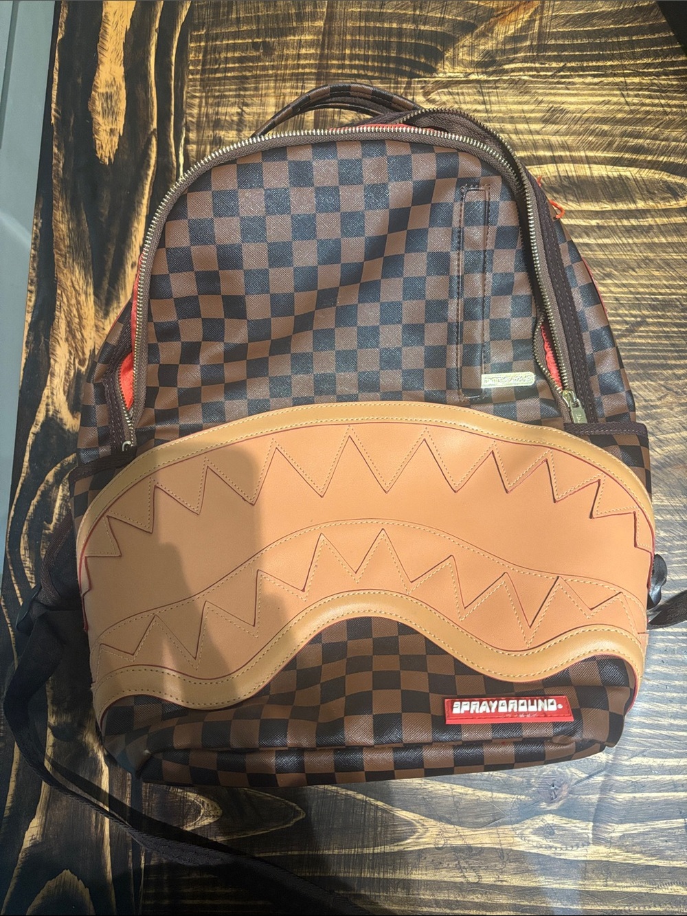 Sprayground Brown Checkerboard Backpack with Tan Leather Accent
